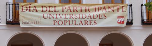 Pancarta que anuncia el encuentro en la plaza de la Constitución